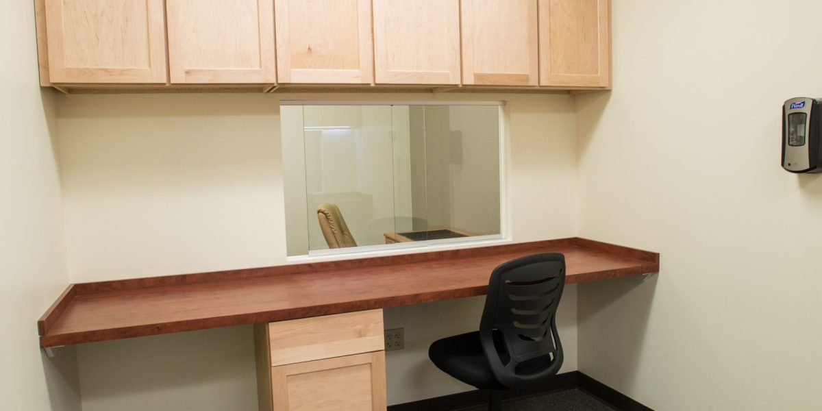 Empty office space with desk and chair